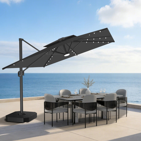 Patioslife 10x13 ft black cantilever umbrella with LED lights over outdoor dining set on ocean view patio