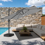 Patioslife 10x13ft charcoal cantilever umbrella with LED lights shading outdoor patio furniture beside pool and stone wall