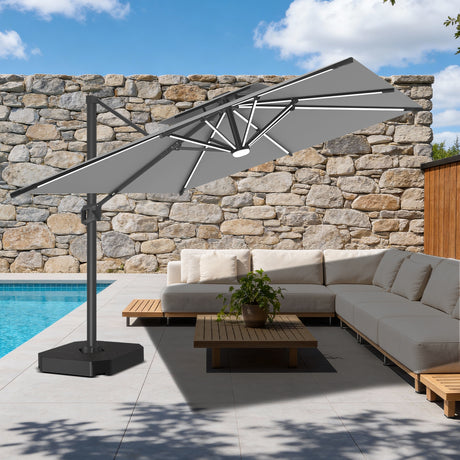 Patioslife 10x13ft charcoal cantilever umbrella with LED lights shading outdoor patio furniture beside pool and stone wall