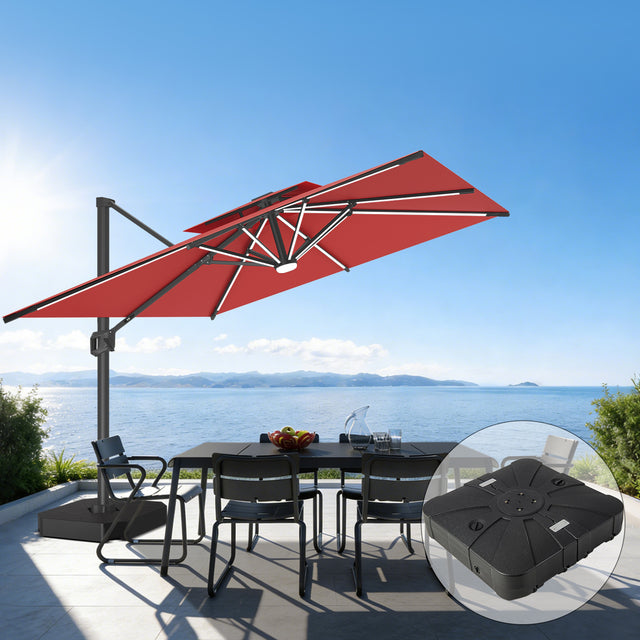 Patioslife 10x13 ft red cantilever umbrella with LED lights and wheeled base over outdoor dining table by ocean