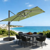 Patioslife 10x13 ft sage green cantilever umbrella with LED lights over outdoor dining table by ocean view patio