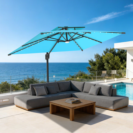 Patioslife 10x13 ft turquoise cantilever umbrella with LED lights over gray sectional sofa and wooden coffee table by pool and ocean